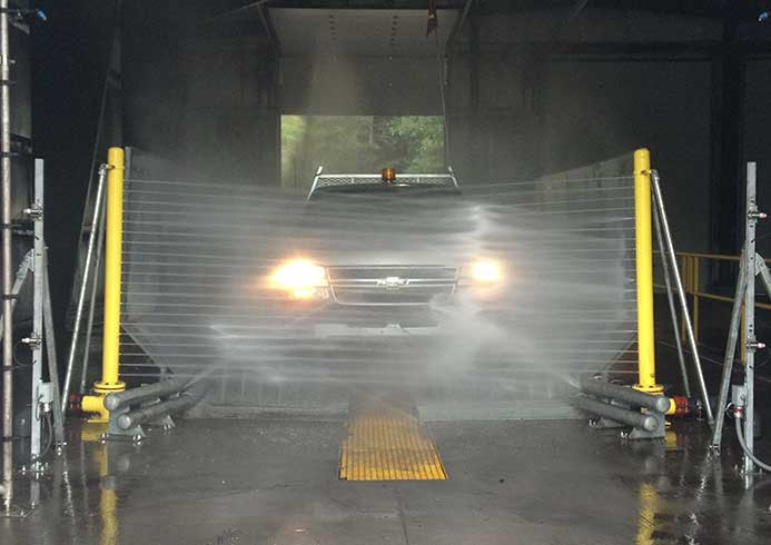 Truck going though automatic heavy wash system.