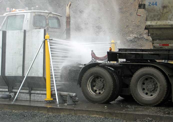 A truck ebing sprayed by fleet washing system.