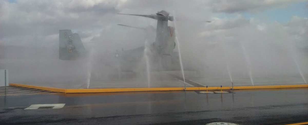 A military helicopter being washed.