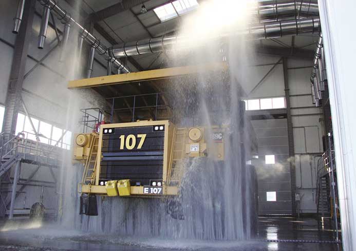 A large construction vehicle being washed.