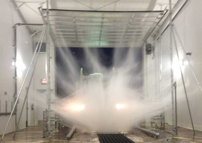 A truck being washed via a fleet wash system.